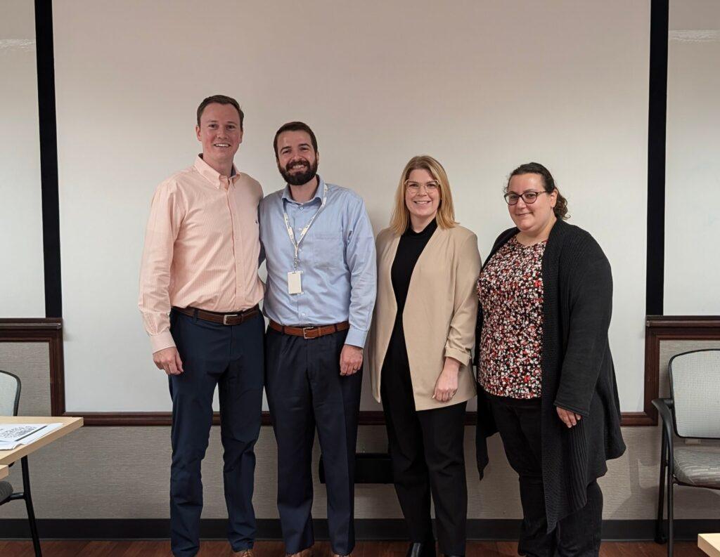 Standing left to right are attorneys Daniel Klementowski, Jason Sikoryak, Alexis Rose, and Jaclyn Terranova against a white background